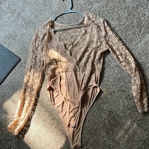 Nude, lace bodysuit. Long sleeves. Size LG.